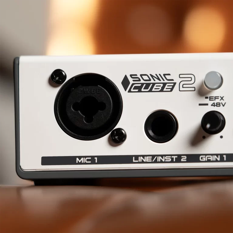 Front panel of a white Sonic Cube 2 audio interface, showing a large black XLR/1/4