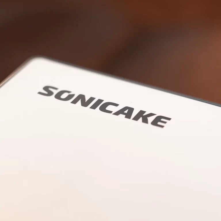 Close-up of a white surface with the bold black word 'SONICAKE' printed on it. ขายราคาพิเศษ