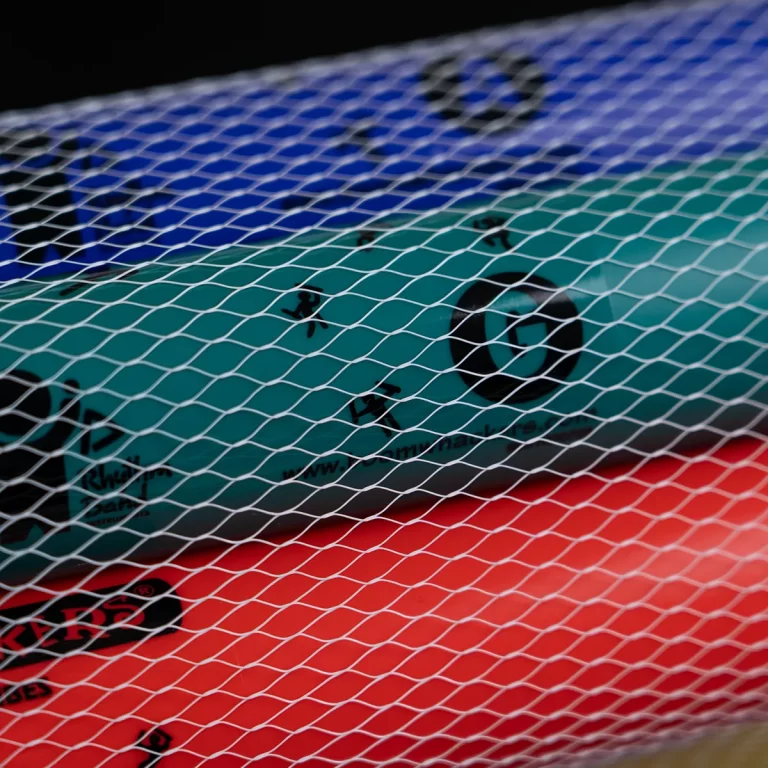 Close-up of a teal and red inflatable pool float seen through a white diamond-pattern netting. ขายราคาพิเศษ