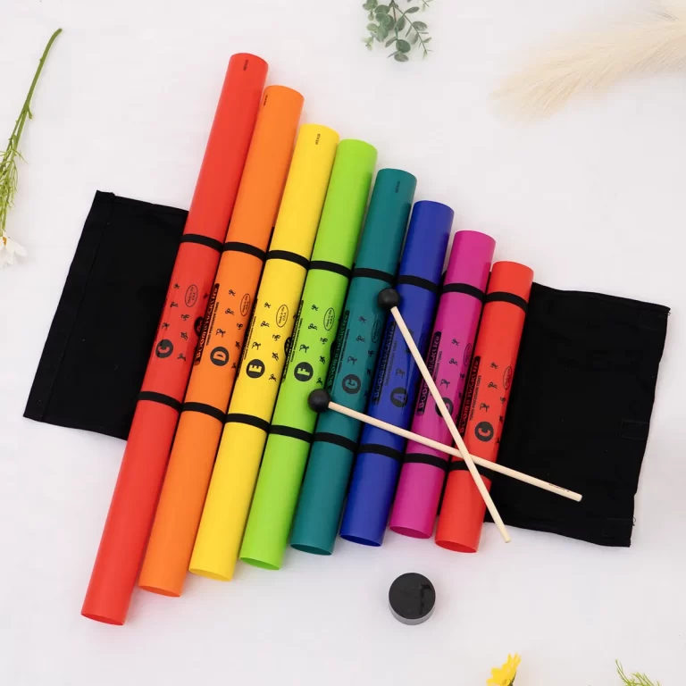 Rainbow Boomwhackers arranged on a black carrying bag with two mallets resting on top. ขายราคาพิเศษ