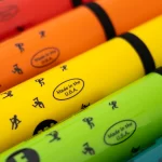 Neon-colored highlighters stacked diagonally in red, orange, yellow, and green, each with a 'Made in the U.S.A.' label. ขายราคาพิเศษ