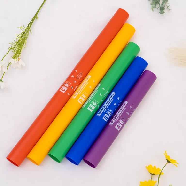 Rainbow-colored craft paper rolls arranged diagonally on a white background (red, orange, yellow, green, blue, purple) ขายราคาพิเศษ