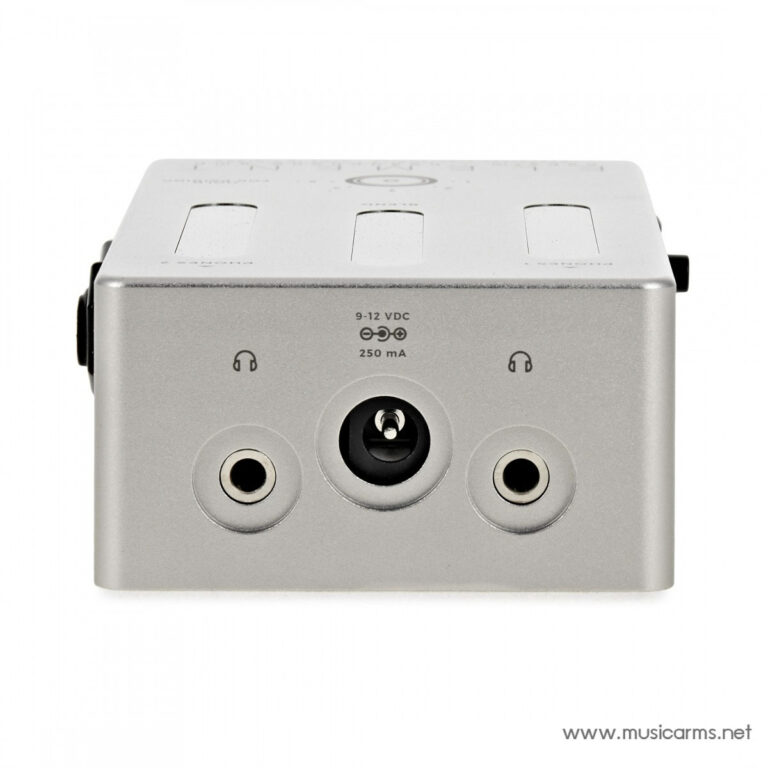 Front view of a compact silver audio accessory: two 1/4-inch jacks on the sides and a center power input, labeled 9–12 VDC 250 mA (MusicArms watermark). ขายราคาพิเศษ