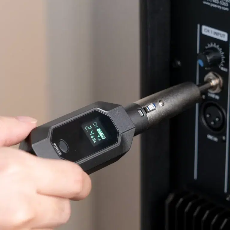 Handheld infrared thermometer aimed at a device's control panel for temperature reading or diagnostics. ขายราคาพิเศษ