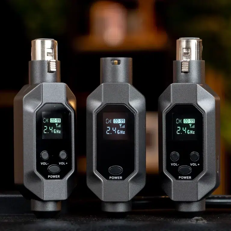 Three grey handheld devices with digital screens showing 2.4 GHz and channel info, standing upright on a surface (informative product close-up). ขายราคาพิเศษ
