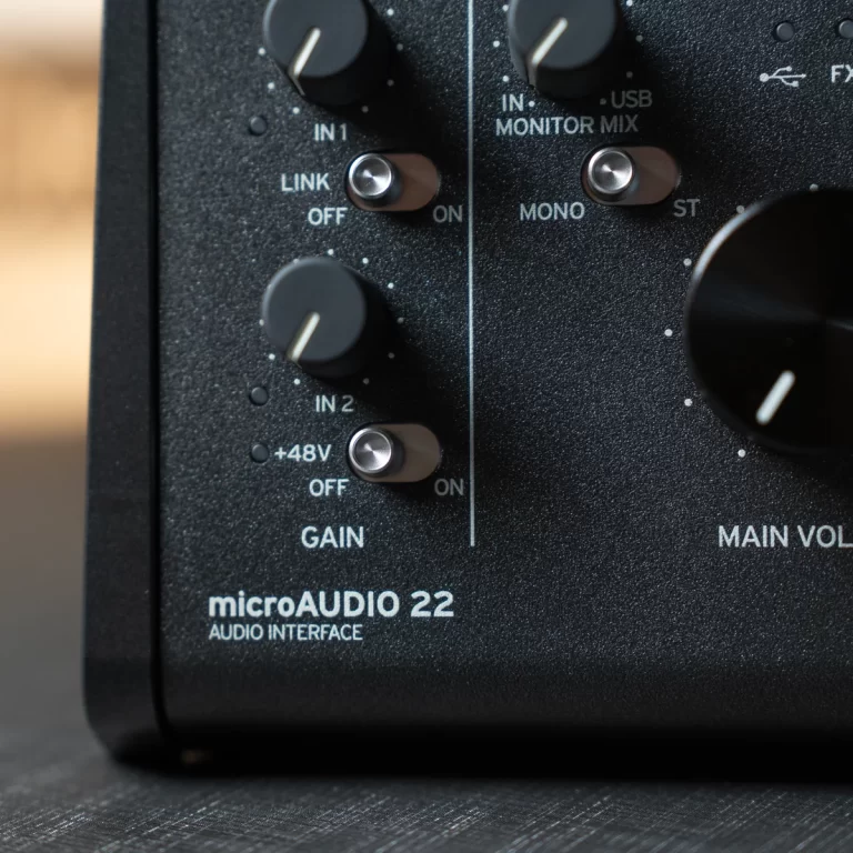Close-up of a microAUDIO 22 front panel showing input gain knobs, +48V switch, and ON/OFF indicators for IN1 and IN2. ขายราคาพิเศษ