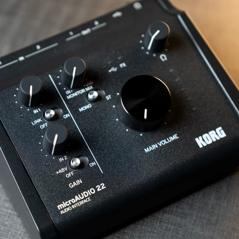 Close-up of a KORG microAUDIO 2 audio interface with knobs for gain, monitor mix, and main volume. ขายราคาพิเศษ