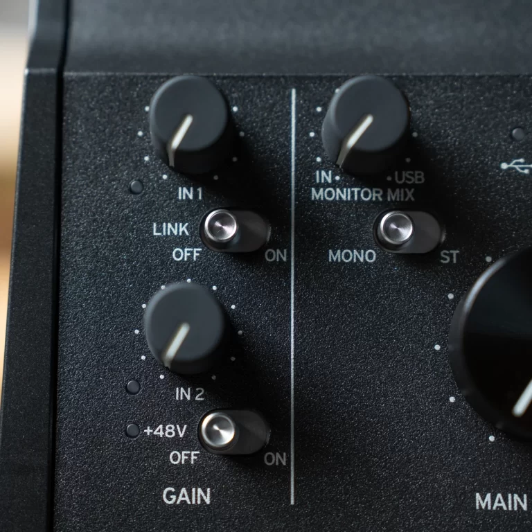 Close-up of a black audio mixer panel showing gain knobs for IN1 and IN2, a phantom power switch labeled +48V, and LINK/ON indicators. ขายราคาพิเศษ