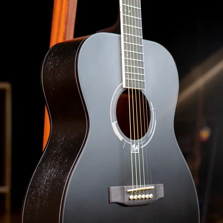 Blue-gray classical acoustic guitar, close-up of body with soundhole and six nylon strings. ขายราคาพิเศษ