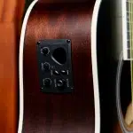Close-up of a brown acoustic guitar body with a black pickup control panel featuring Bass, Middle, Treble, and Volume knobs. ขายราคาพิเศษ