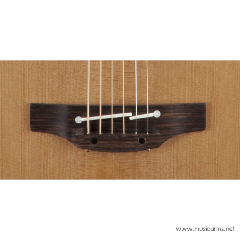 Close-up of a four-string ukulele bridge on a warm brown soundboard; nylon strings anchor to dark wood bridge with a white saddle. ขายราคาพิเศษ
