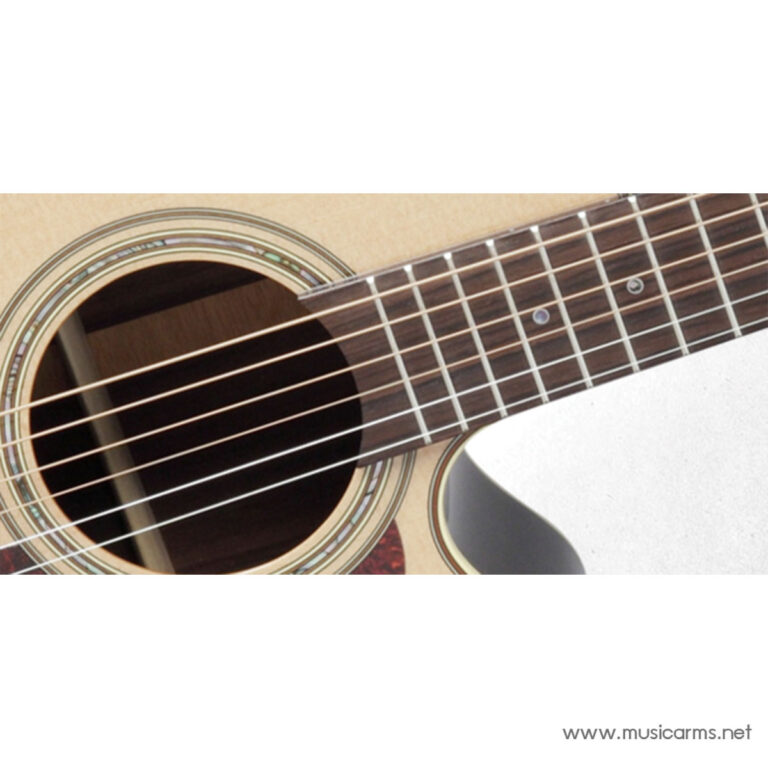 Close-up of an acoustic guitar showing the sound hole, strings, and fretboard. ขายราคาพิเศษ