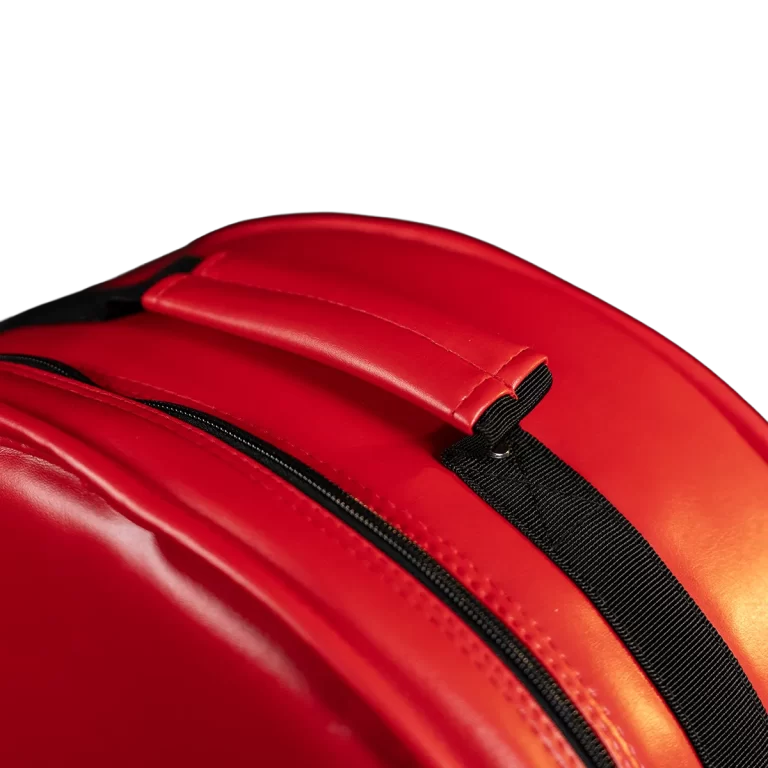 Close-up of a red backpack with a black zipper and strap ขายราคาพิเศษ