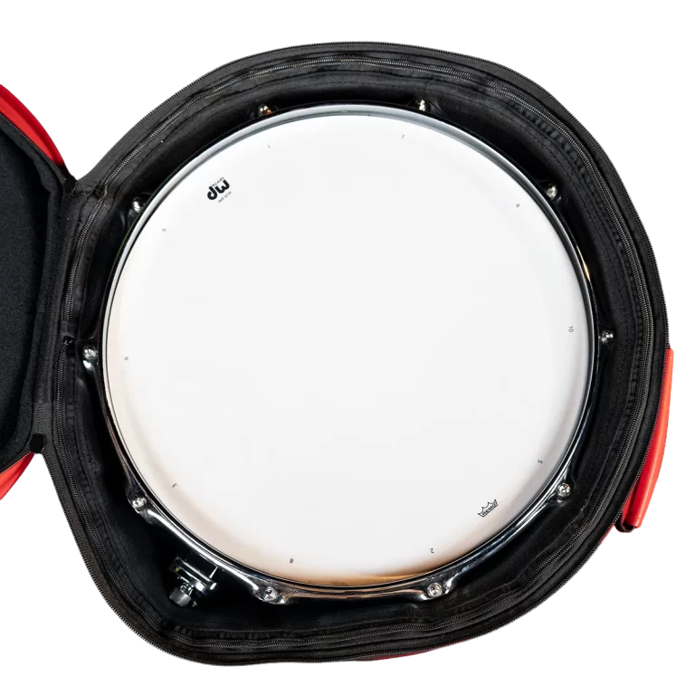 Close-up of a white snare drum head inside a black padded drum case with red zipper, showing the DW logo. ขายราคาพิเศษ