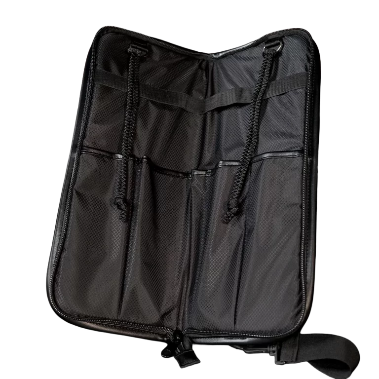 Black travel organizer with multiple pockets and zipper closure, laid open to show interior compartments and elastic loops. ขายราคาพิเศษ