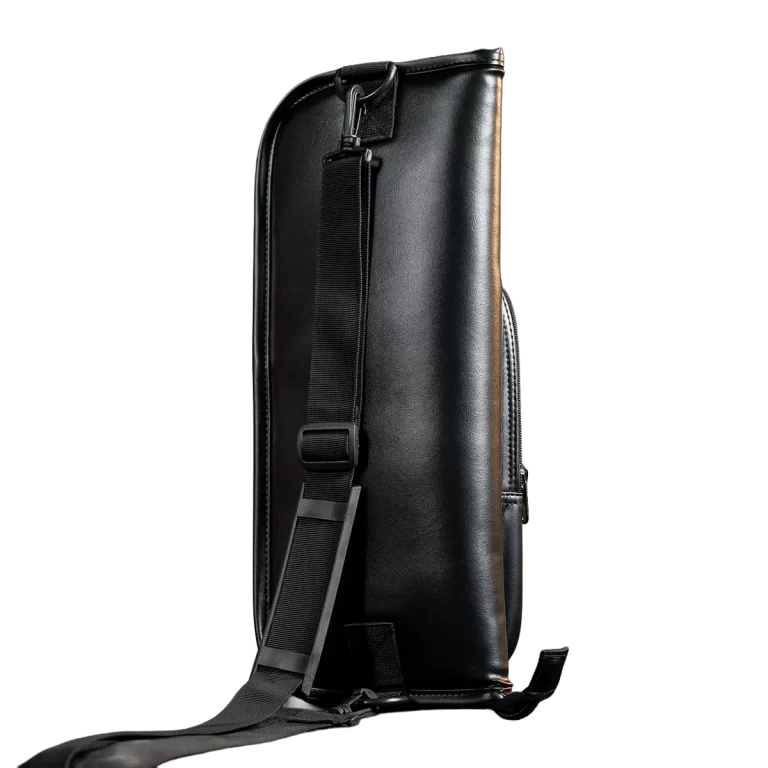Side view of a black leather bag with an adjustable shoulder strap. ขายราคาพิเศษ