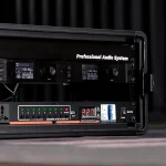 Rack-mounted professional audio system with two display panels and a row of green LEDs in a flight case ขายราคาพิเศษ