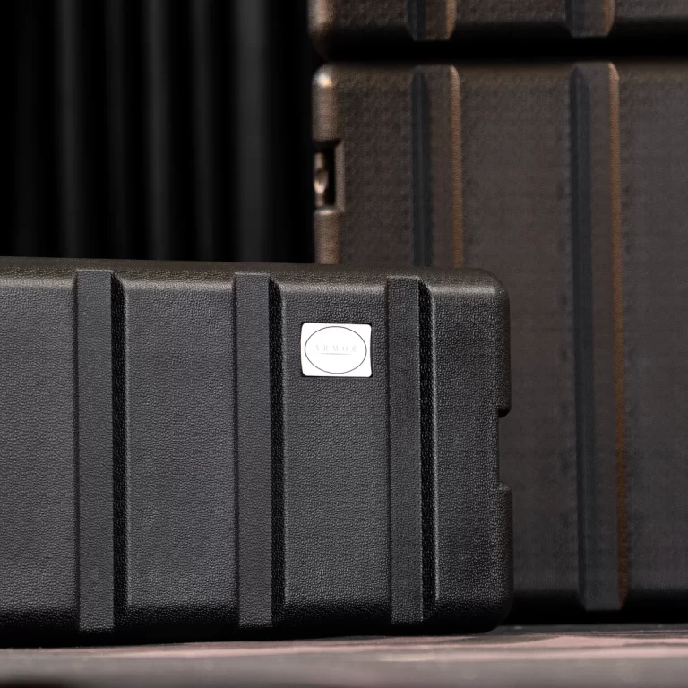 Close-up of a black rugged protective case with a small white oval label reading ARMOR. ขายราคาพิเศษ