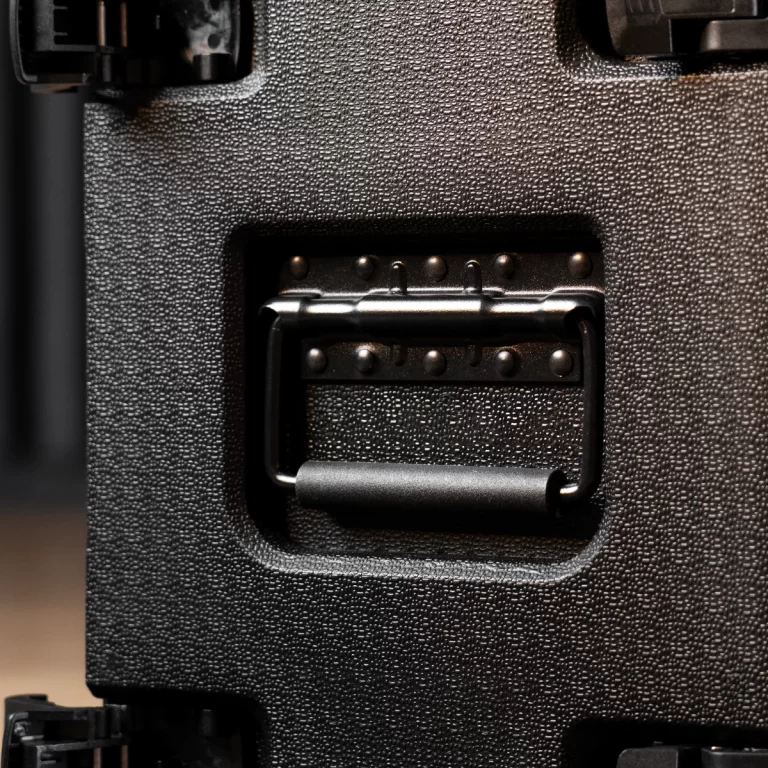 Close-up of a metal latch and hasp securing a textured black protective case lid. ขายราคาพิเศษ