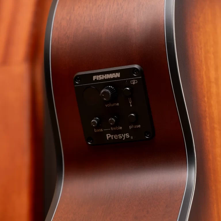 Close-up of a sunburst acoustic guitar body showing the Fishman Presys II onboard preamp panel with volume and tone knobs ขายราคาพิเศษ