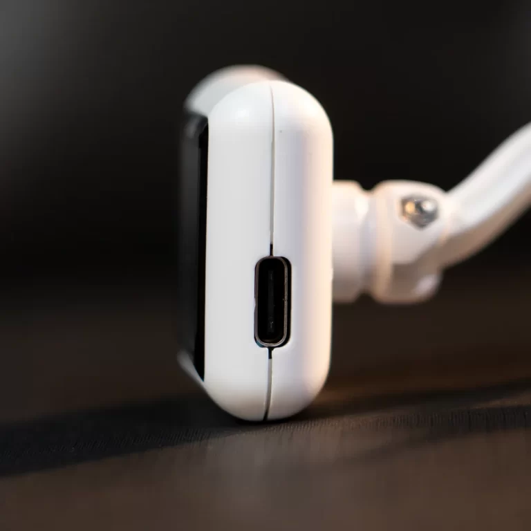 Close-up of a white device edge showing a USB-C charging port against a dark background ขายราคาพิเศษ
