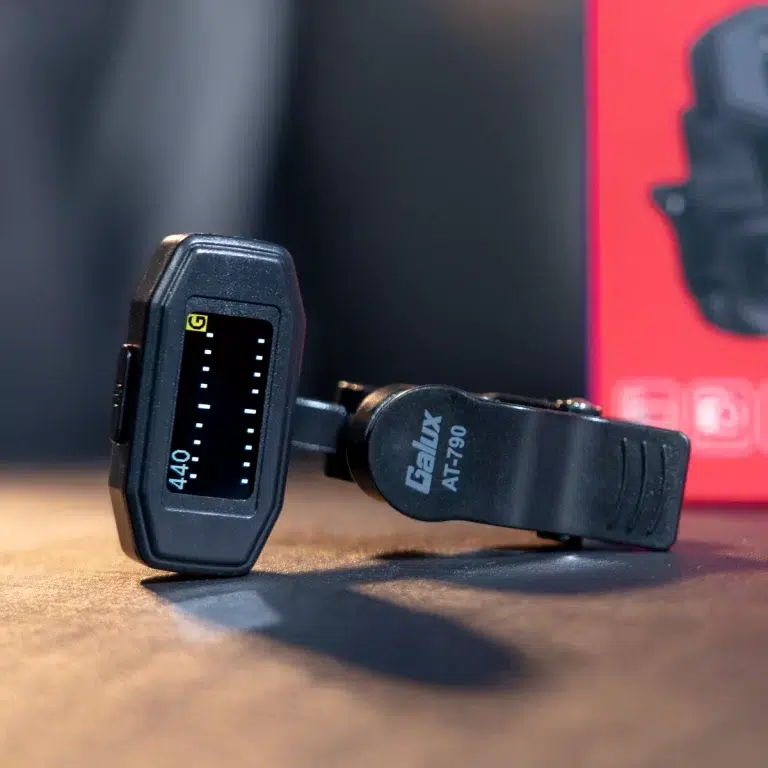 Close-up of a Galux AT-790 wearable sensor with a vertical LCD readout on a wooden surface. ขายราคาพิเศษ