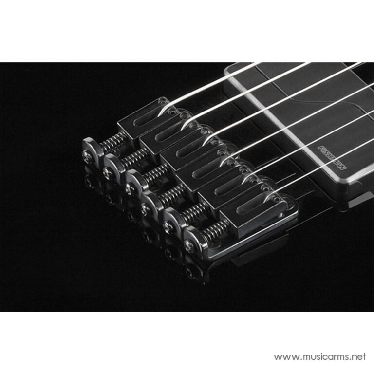 Close-up of a metal guitar bridge with strings on a black background (electric guitar tailpiece). ขายราคาพิเศษ