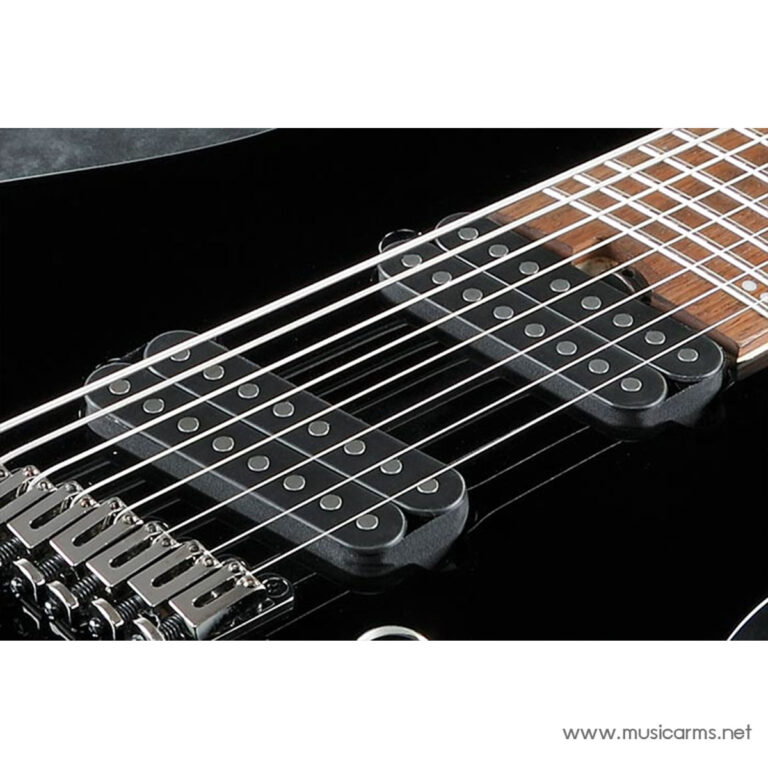 Close-up of a black electric guitar showing dual humbucker pickups, strings, and chrome bridge with a wooden fretboard area visible to the right ขายราคาพิเศษ
