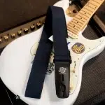 White electric guitar with a dark blue strap draped over its body; a black strap lock labeled 'Lock-It' is visible on the strap end. ขายราคาพิเศษ