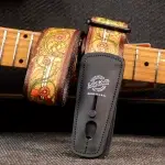 Floral-patterned leather guitar strap with brown edges attached to a guitar neck, showing a LOCK-IT strap lock in use. ขายราคาพิเศษ