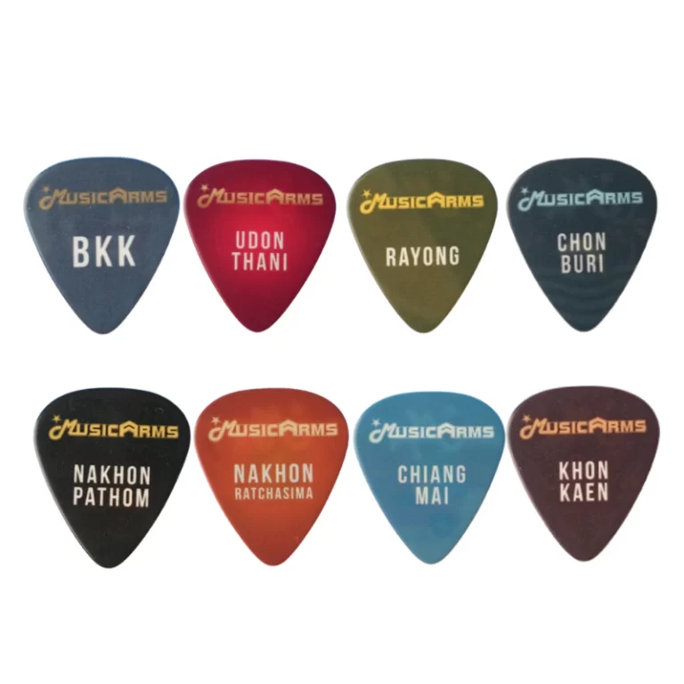 Eight colored MusicArms guitar picks with city names (BKK/Bangkok, Udon Thani, Rayong, Chon Buri, Nakhon Pathom, Nakhon Ratchasima, Chiang Mai, Khon Kaen). ขายราคาพิเศษ