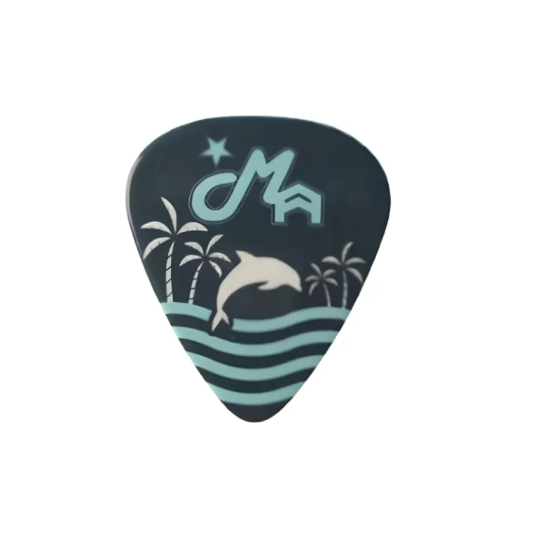 Tropical-themed guitar pick with palm trees, dolphins, waves, and a pale blue MA logo on dark blue background. ขายราคาพิเศษ