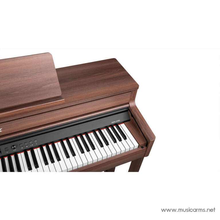 Angled view of a brown wooden upright piano with its keyboard and lid visible. ขายราคาพิเศษ