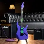 Purple electric guitar with neon green pickups stands on a floor, connected to a purple cable, with Marshall amp in the background. ขายราคาพิเศษ