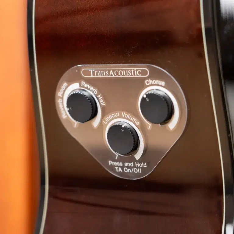 Guitar control panel labeled TransAcoustic with three knobs for Reverb, Chorus, and Lineout/Volume on a brown finish guitar body. ขายราคาพิเศษ