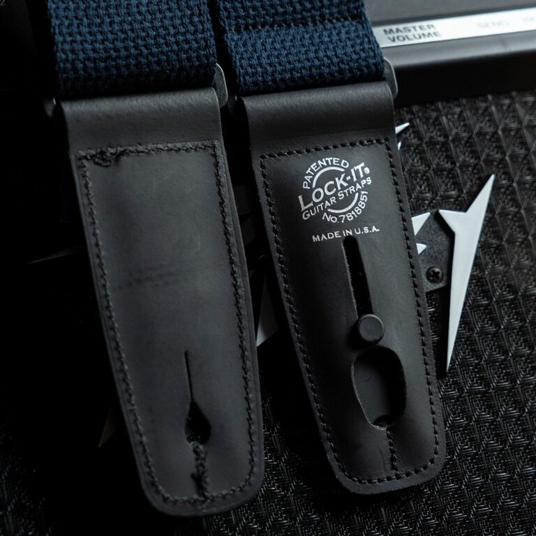 Guitar strap with black leather ends and embossed patent information: 'LOCK-IT Guitar Straps Made in U.S.A.' ขายราคาพิเศษ