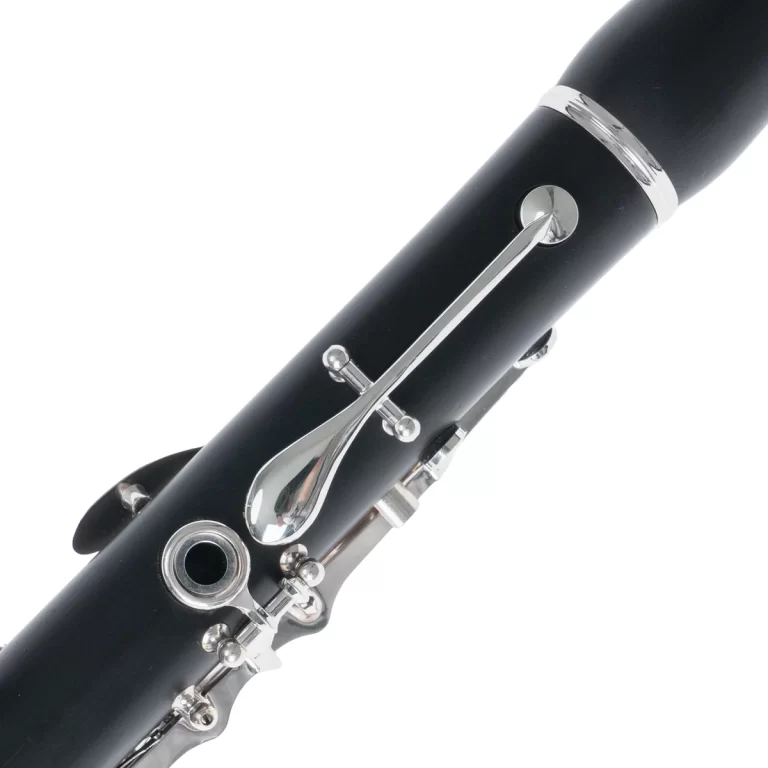 Close-up of a black clarinet body with shiny silver keys and rods along the tone hole area ขายราคาพิเศษ