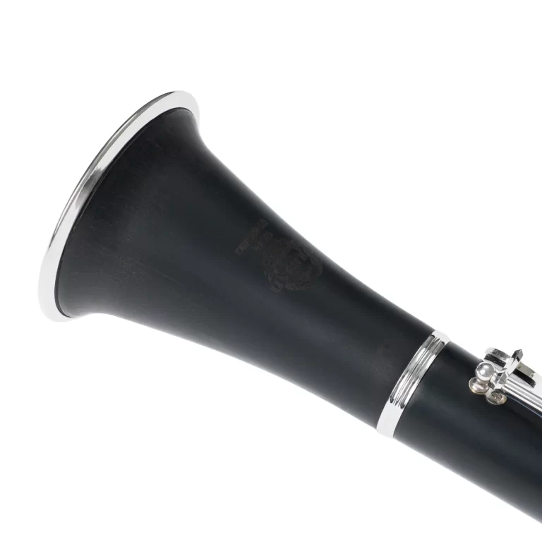 Close-up of a black clarinet mouthpiece with a silver ligature and metal ring. ขายราคาพิเศษ