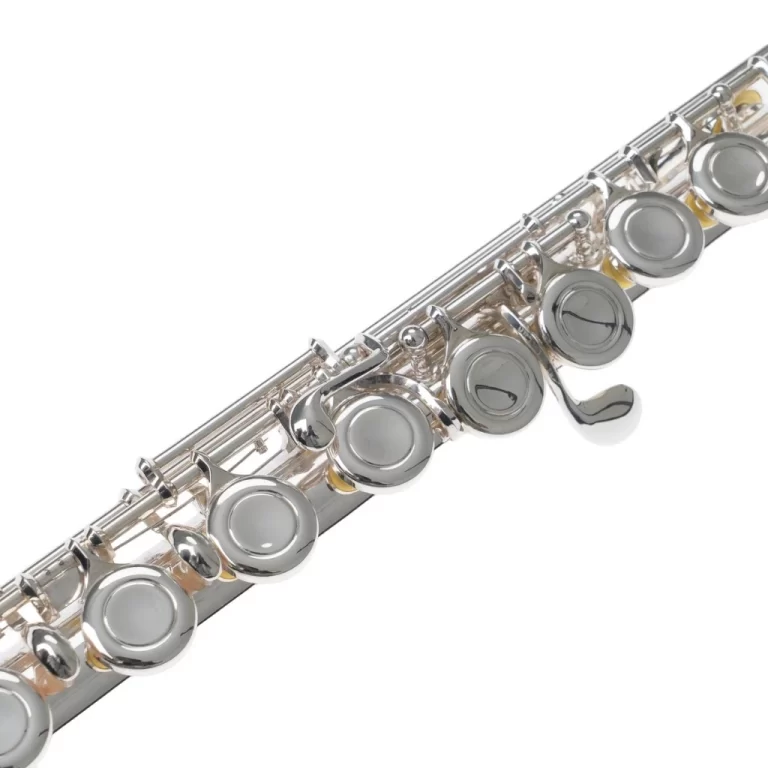 Close-up of a silver flute’s keys and pads along its body, diagonally oriented against a white background. ขายราคาพิเศษ