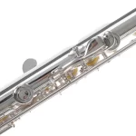 Close-up of a silver flute showing its keys, rods, and pads along the body. ขายราคาพิเศษ
