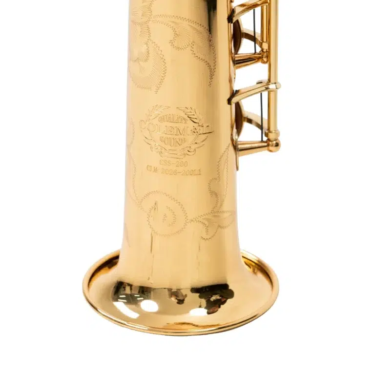 Close-up of a polished gold saxophone bell with ornate engravings and a maker's seal visible on the side (Quality Coleman Sound). ขายราคาพิเศษ