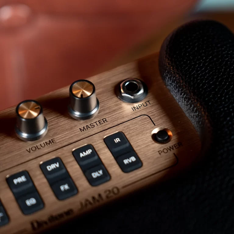 Close-up of a brass-colored audio panel with Volume, Master knobs and an Input jack, a microphone resting nearby. ขายราคาพิเศษ