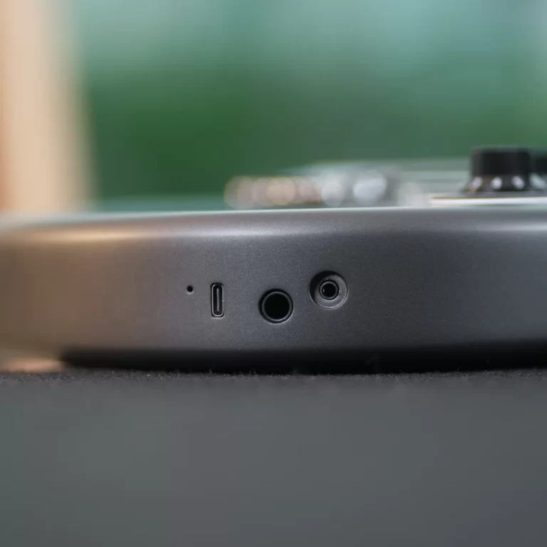 Close-up of a laptop side: USB-C port, 3.5mm audio jack, and a circular microphone jack. ขายราคาพิเศษ