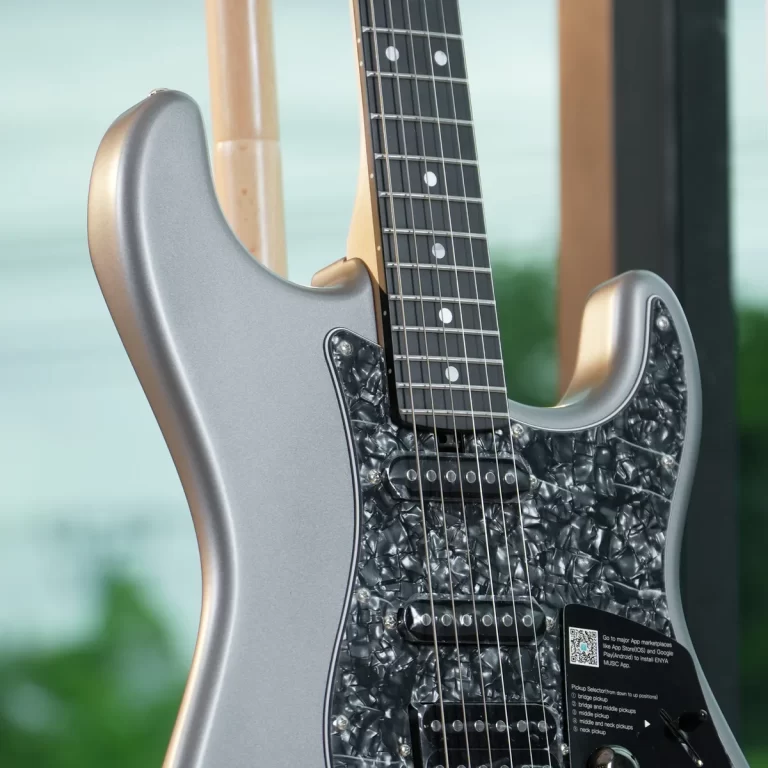 Close-up of a silver electric guitar showing the neck, pearl inlays, and black pearloid pickguard with pickups. ขายราคาพิเศษ