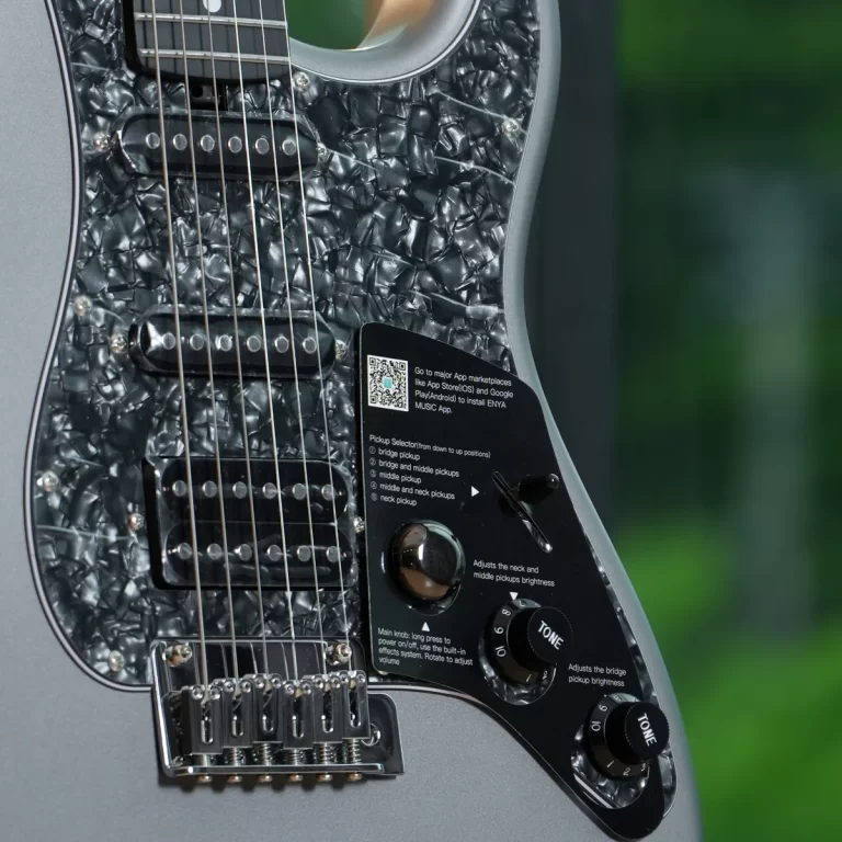 Close-up of an electric guitar body with a black marbled pickguard, two pickups, and control knobs visible along the lower bout. ขายราคาพิเศษ