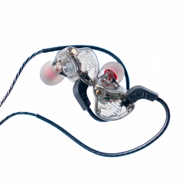 Clear custom in-ear monitor (IEM) earphones with black cable and red ear tip accents. Used for audio monitoring in-ear. ขายราคาพิเศษ