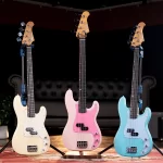 Three pastel-colored electric guitars on stands arranged in a row on a stage, left in cream, center in pink with a darker pickguard, and right in light blue against a dark backdrop. ขายราคาพิเศษ