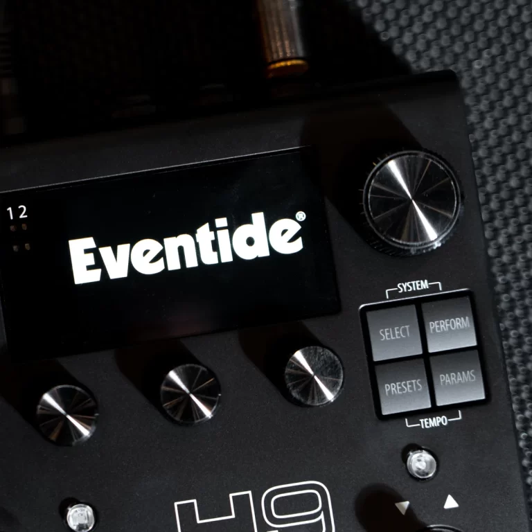 Close-up of an Eventide effects unit showing the brand on the display and metal knobs on a dark panel (guitar pedal). ขายราคาพิเศษ