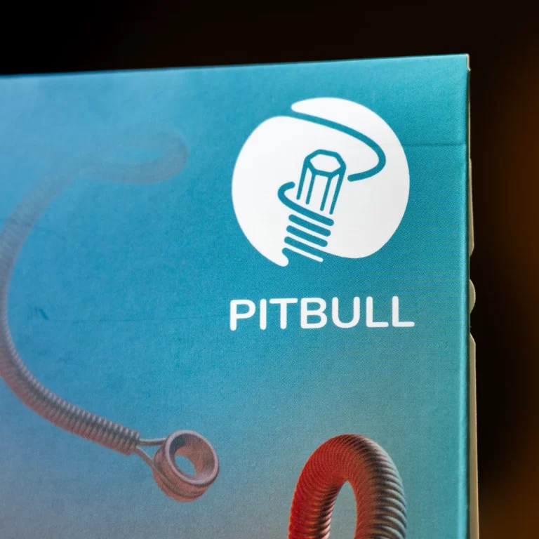 Blue packaging box featuring a white Pitbull logo with a lightbulb design and the word PITBULL; hoses appear at the bottom edges of the box. ขายราคาพิเศษ