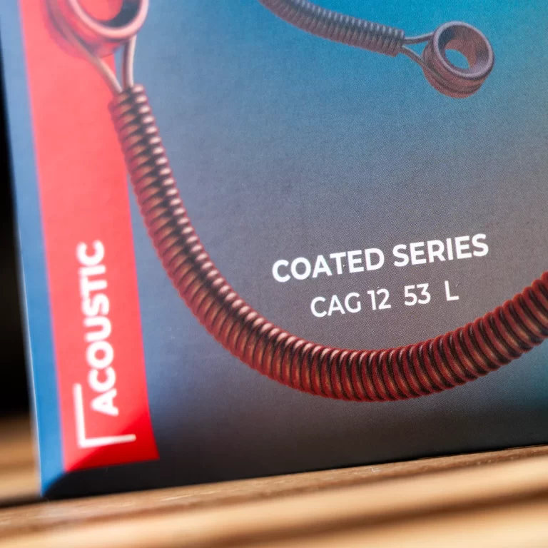 Close-up of a product box showing 'COATED SERIES' and 'CAG 12 53 L' with a coiled cable and red Acoustic label. ขายราคาพิเศษ